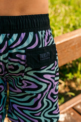 Boy wearing Dreamwave hybrid anti-chafe boardshorts outdoors - Thirsty Threads