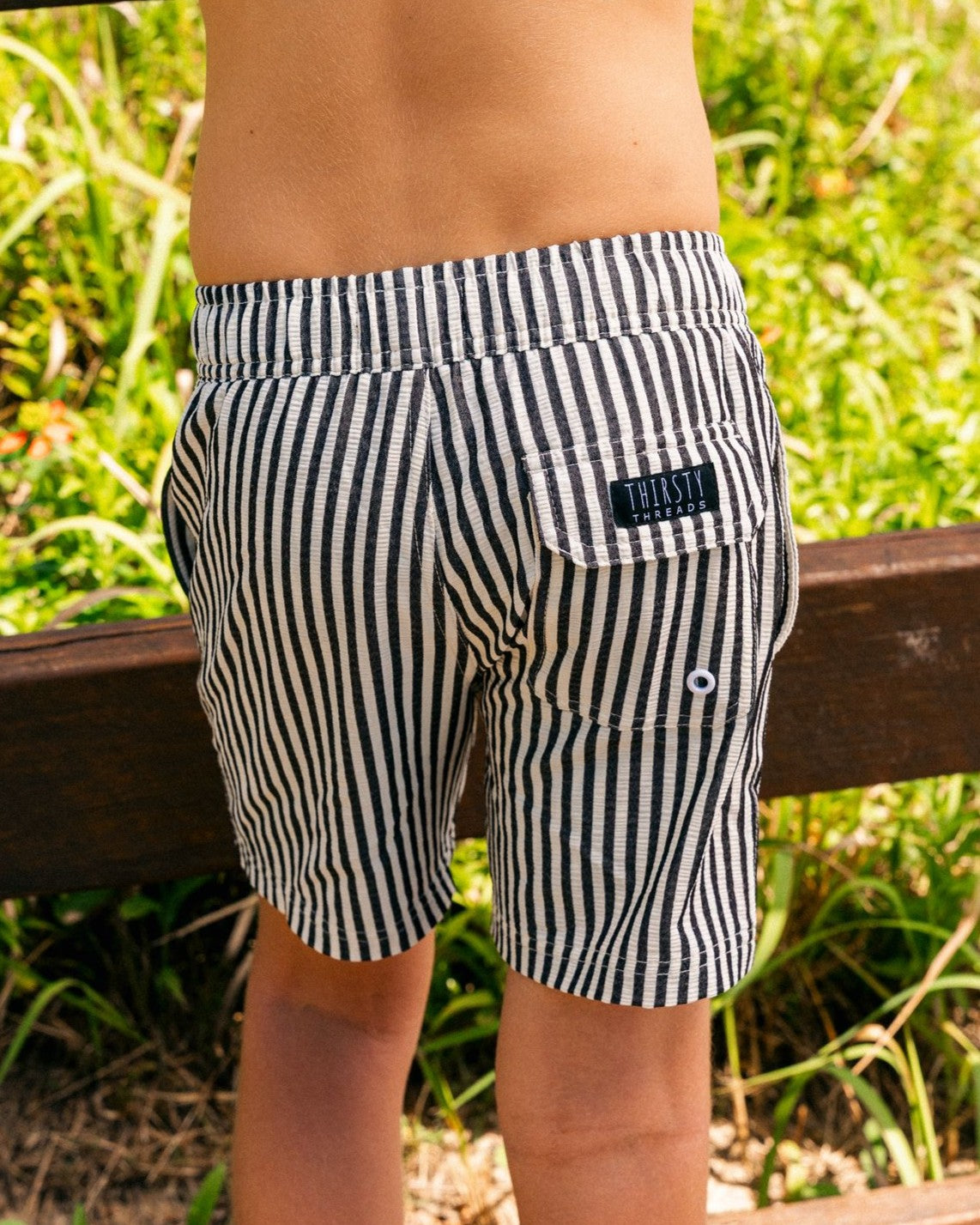 Rear fit of boys Midnight Stripe hybrid lined boardshorts with quick dry 4-way stretch fabric