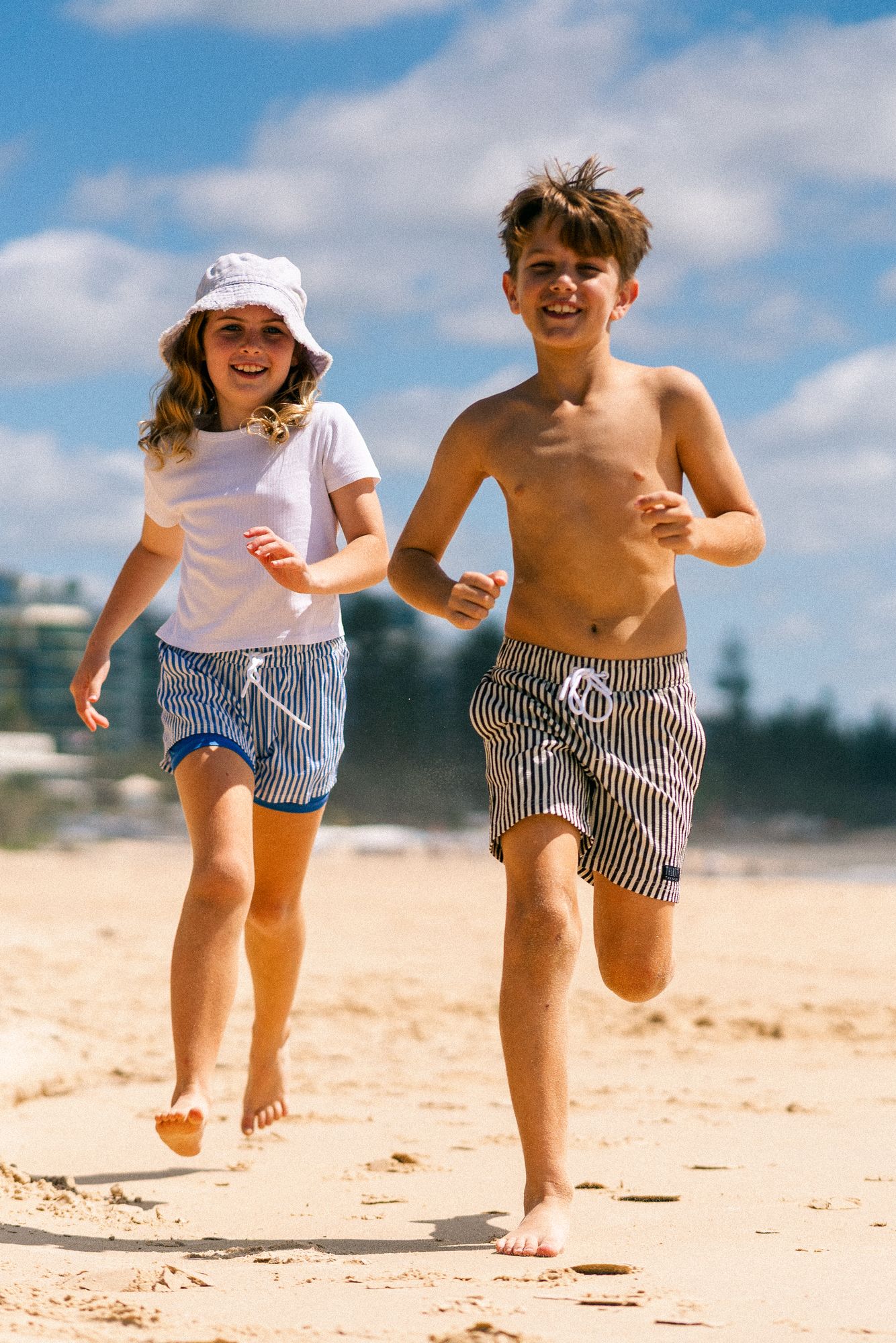 Boy wearing Midnight Stripe hybrid anti-chafe boardshorts outdoors - Thirsty Threads