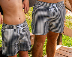 Matching boys Midnight Stripe hybrid lined anti-chafe boardshorts with quick dry 4-way stretch fabric outdoors