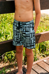 Boy wearing Mint Geo hybrid anti-chafe boardshorts with soft quick dry liner and stretch fabric